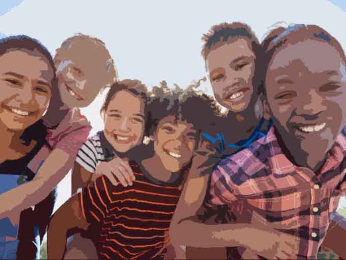 Six pre-teen friends piggybacking in a park, close up portrait