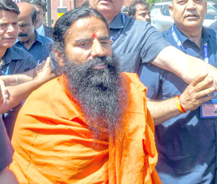 New Delhi, Apr 2 (ANI): Yog Guru Baba Ramdev leaves the Supreme Court after appearing in the misleading advertisement case filed against the Patanjali Ayurveda, in New Delhi on Tuesday. He tendered an unconditional apology before the Supreme Court for violating the apex court's order for misleading advertisements of Patanjali's medicinal products. (ANI Photo/Amit Sharma)