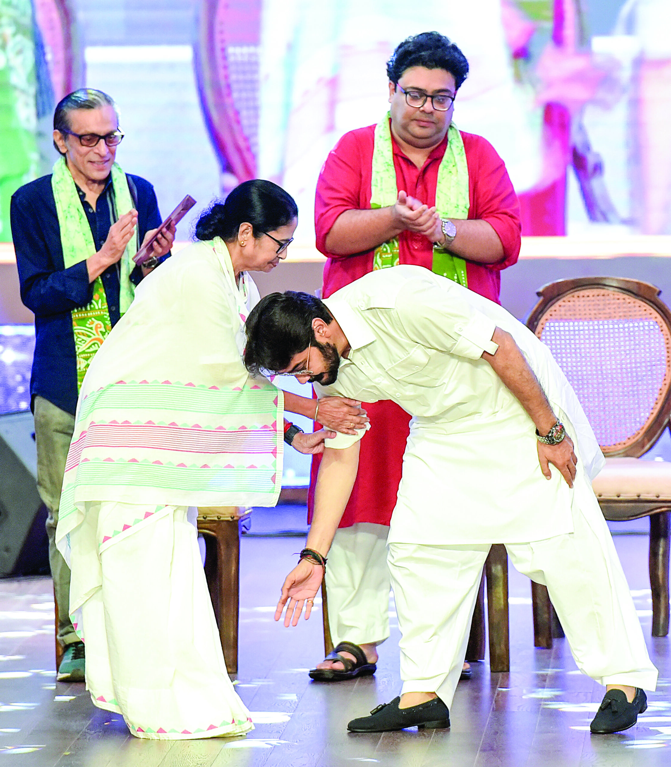 Kolkata, Jul 24 (ANI): West Bengal Chief Minister Mamata Banerjee blesses 'Mahanayak' award winning actor Prosenjit Chatterjee during the 44th death anniversary function of actor Uttam Kumar (Mahanayak), in Kolkata on Wednesday. (ANI Photo)