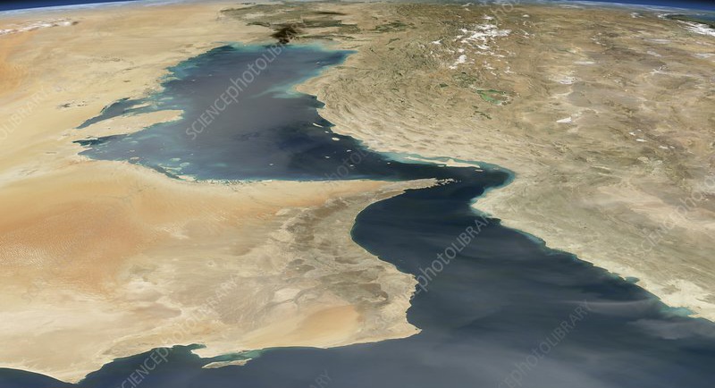 Strait of Hormuz, satellite image. Iran is at right, Iraq at top centre, Saudi Arabia at centre left and Oman at bottom left with the United Arab Emirates above it. This narrow strait links the Persian Gulf (upper centre) to the Arabian Sea (bottom). It is the only route for ships carrying exports from the major oil-producing countries around the Persian Gulf. Smoke clouds from burning oil at a ruptured pipeline are seen over the Iraqi coast. Image obtained on 24th March 2004.